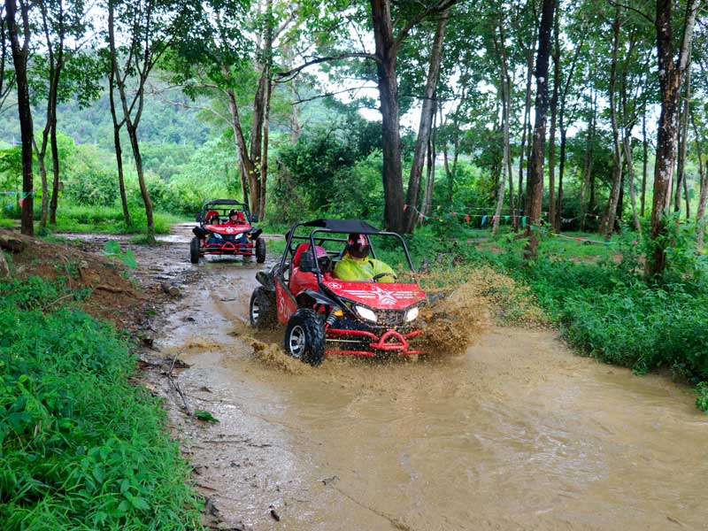 Guest driving UTV buggy on jungle track in Phuket